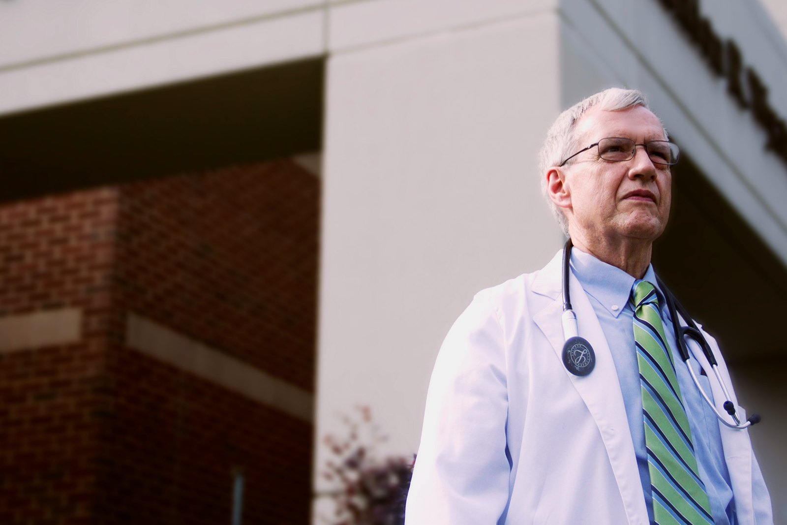 Dr. Gary Miller outside in his physician’s coat